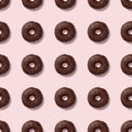 Colorful seamless pattern with glazed chocolate donuts. Pink pastel background. Confectionery banner Royalty Free Stock Photo