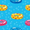 Colorful seamless summer pattern with hand drawn beach elements. Summer pool floating with inflatable circle. Seamless