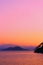 Colorful seascape. Clouds and mountains on the horizon Royalty Free Stock Photo