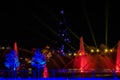 Colorful season trees and jets of dancing waters at Seaworlds Christmas Celebration.