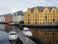 Colorful secessionist buildings of european Alesund town reflected in the water in Norway Royalty Free Stock Photo