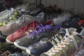 Colorful of second hand shoes for sale at street flea market. Royalty Free Stock Photo