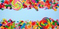 Colorful candies, top view double border with a blue banner background