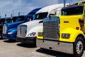 Indianapolis - Circa June 2018: Colorful Semi Tractor Trailer Trucks Lined up for Sale I Royalty Free Stock Photo