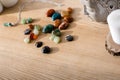 Colorful semiprecious stones on brown wooden surface