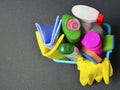 Colorful set of cleaning supplies in a blue basket with copy space. Royalty Free Stock Photo