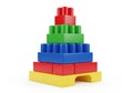 A colorful set of interlocking plastic building blocks stacked in a pyramid shape Royalty Free Stock Photo