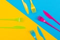 Colorful set of vibrant forks and knife on black