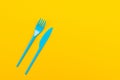 Colorful set of vibrant forks and knife isolated on black