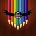 Colorful seven pencils on the wooden background