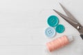Colorful sewing accessories on white wooden table, close up Royalty Free Stock Photo