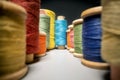 between colorful sewing thread spools Royalty Free Stock Photo