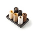 Colorful sewing threads arranged neatly on a tray showcasing various shades for creative projects Royalty Free Stock Photo
