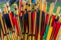 Colorful shafts of wooden arrows with real bird feathers for shooting with a bow