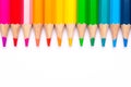 Colorful sharp bright pencils are a smooth line on a white background, a symbol of LGBT