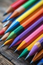 Colorful Sharpened Pencils in Spectrum Order on Rustic Desk Royalty Free Stock Photo