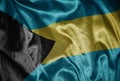 colorful shining big national flag of bahamas on a silky texture Royalty Free Stock Photo