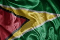 colorful shining big national flag of guyana on a silky texture Royalty Free Stock Photo