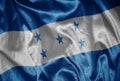 colorful shining big national flag of honduras on a silky texture Royalty Free Stock Photo