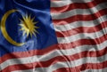 colorful shining big national flag of malaysia on a silky texture Royalty Free Stock Photo