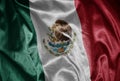 colorful shining big national flag of mexico on a silky texture Royalty Free Stock Photo