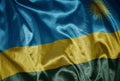 colorful shining big national flag of rwanda on a silky texture Royalty Free Stock Photo