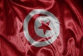 colorful shining big national flag of tunisia on a silky texture Royalty Free Stock Photo