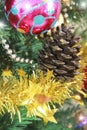 Colorful shiny Christmas toys balls on the tree for the new year holiday Royalty Free Stock Photo