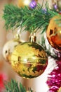 Colorful shiny Christmas toys balls on the tree for the new year holiday Royalty Free Stock Photo