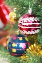 Colorful shiny Christmas toys balls on the tree for the new year holiday Royalty Free Stock Photo