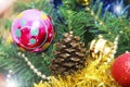 Colorful shiny Christmas toys balls on the tree for the new year holiday Royalty Free Stock Photo