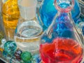 Colorful shiny fancy creates laboratory glass and coloured liquids.