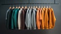 shirts and pullovers on hangers in a wardrobe Royalty Free Stock Photo