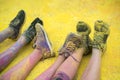 The colorful shoes and legs of teenagers at color run event Royalty Free Stock Photo