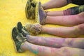 The colorful shoes and legs of teenagers at color run event Royalty Free Stock Photo