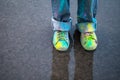 Colorful shoes on puddle Royalty Free Stock Photo