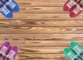 Colorful shoes set on wooden background with copy space. Top view. Royalty Free Stock Photo