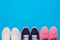 Colorful  shoes top view. Set of different sneakers on blue background, copy space Royalty Free Stock Photo