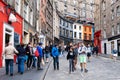 Colorful shopfronts and tourists at the famous Victoria Street in Edinburgh