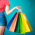 Colorful shopping bags in female hand. Sale retail Royalty Free Stock Photo