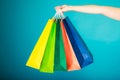 Colorful shopping bags in female hand. Sale retail Royalty Free Stock Photo