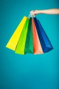 Colorful shopping bags in female hand. Sale retail Royalty Free Stock Photo