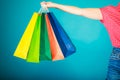 Colorful shopping bags in female hand. Sale retail Royalty Free Stock Photo