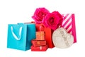 Colorful shopping bags, gift boxes and roses isolated on white Royalty Free Stock Photo