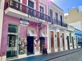 Pastel colored shops line Calle de la Fortaleza, a street in Old San Juan