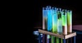 Colorful shot drinks in glass tubes. Dark background, atmospheric bar image. Laboratory glassware with alcohol cocktails