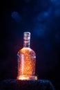 A colorful shot of a sparkling gin in the glass bottle.