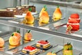 Colorful showcase of cafe with fresh sweet cakes and fruit shaped pastries Royalty Free Stock Photo