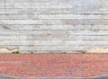 Colorful sidewalk and gray wall