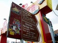 A colorful sign announces the address of the Chinatown street market and Chinatown Heritage Center in Singapore in several languag